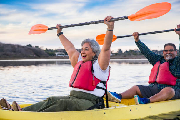 istock Senior Mexican Couple Kayaking Celebrating 905400620
