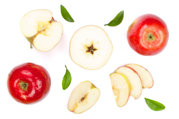 istock red apples with slices and leaves isolated on white background top view. Set or collection. Flat lay pattern 905401006