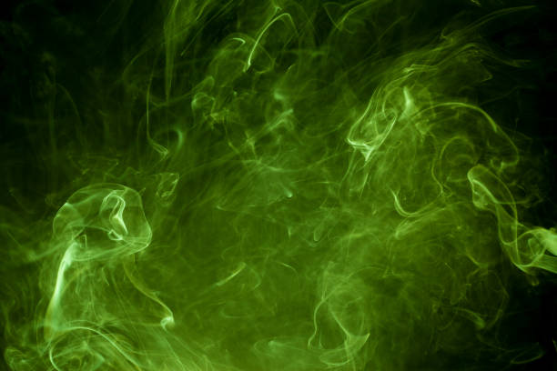 istock Green smoke on a black background. smoke on a black background. 905402010