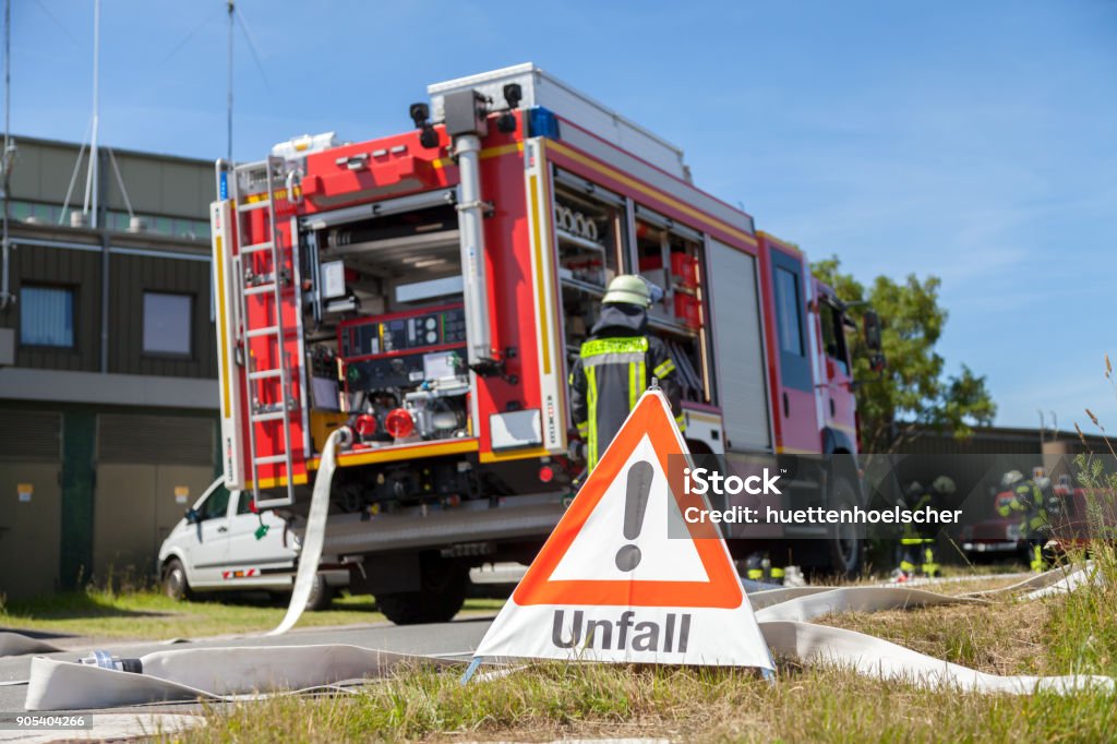 german Unfall ( accident ) sign near a fire truck Car Accident Stock Photo