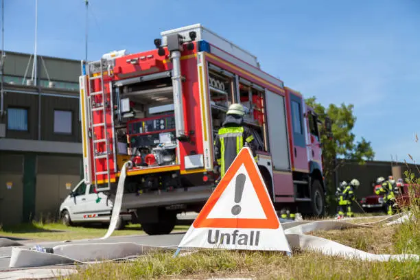 german Unfall ( accident ) sign near a fire truck