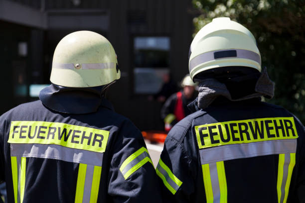 istock german fireman ( Feuerwehr ) stands near an accident 905404270