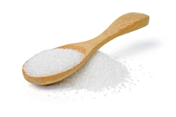 istock white sugar in wood spoon on white background 905404410