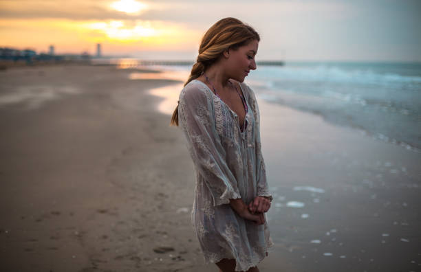 istock Dreamy girl on beach 905404574