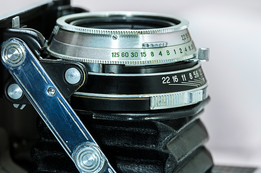 adjustment dials on lens of classic retro camera, closeup view