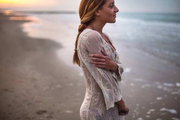 istock Dreamy girl on beach 905405264