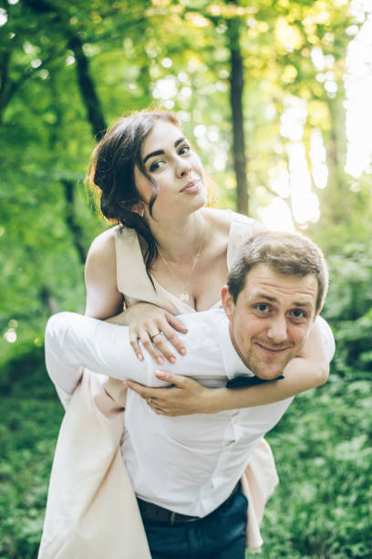 istock woman jump on mans back 905409000