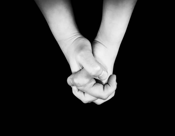 istock Photo of praying hands. 905409360