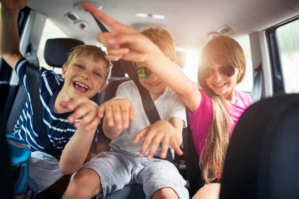 istock Brothers and sisters enjoying travelling by car 905409574