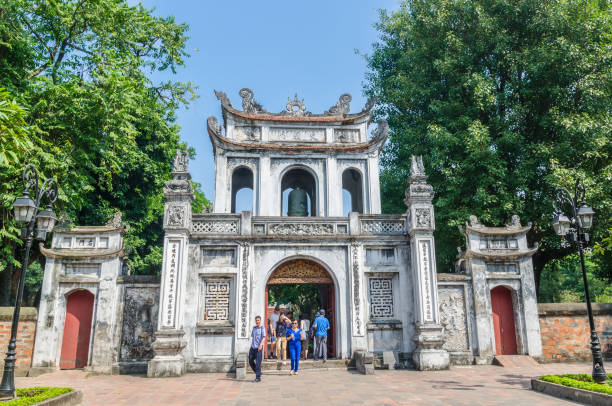 Entrance of the Temple of Literature, it also known as Temple of Confucius in Hanoi. People can seen exploring around it. stock photo