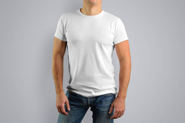 istock man in a white t-shirt is isolated on a gray background. 905413440