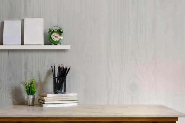 istock Mock up desk top concept, Workspace with office supplies , books on white marble table. 905414184