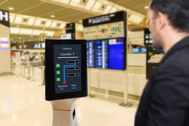 istock Smart robotic technology concept, The passenger follow a service robot to a counter check in in airport, the robot can help and give some information to passenger quickly 905416834