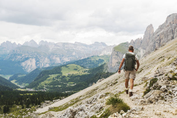 istock Senior man trail hiking on the Dolomites 905420348