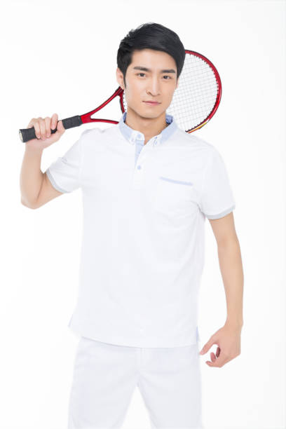 istock young man playing tennis over white background 905422328