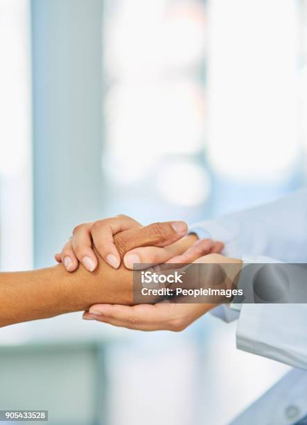 Any Challenge Is One Well Face Together Stock Photo - Download Image Now - Doctor, Holding Hands, Patient