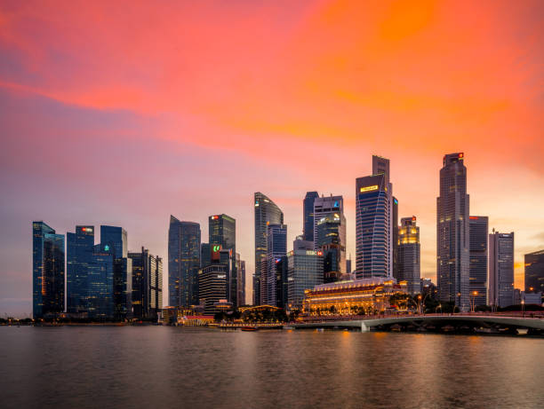 istock Singapore skyline at sunset 905434592