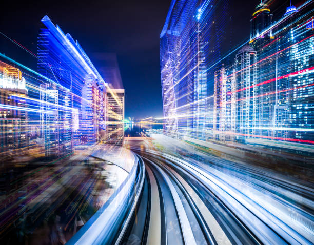 City in motion Digital composite of a train traveling through a futuristic city. commuter train photos stock pictures, royalty-free photos & images