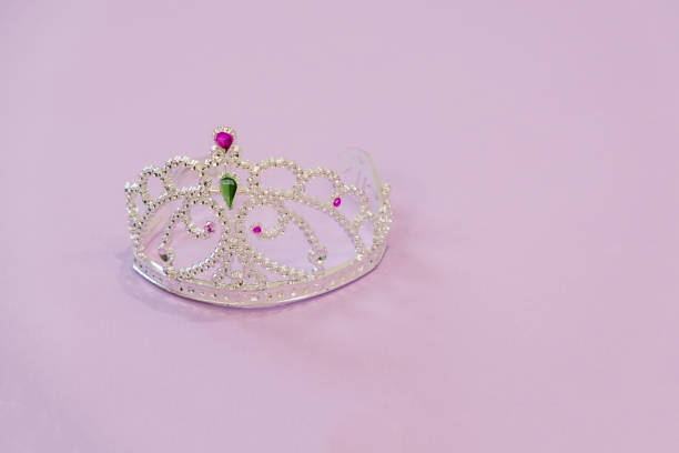 istock Crown princess on a pink background 905434892