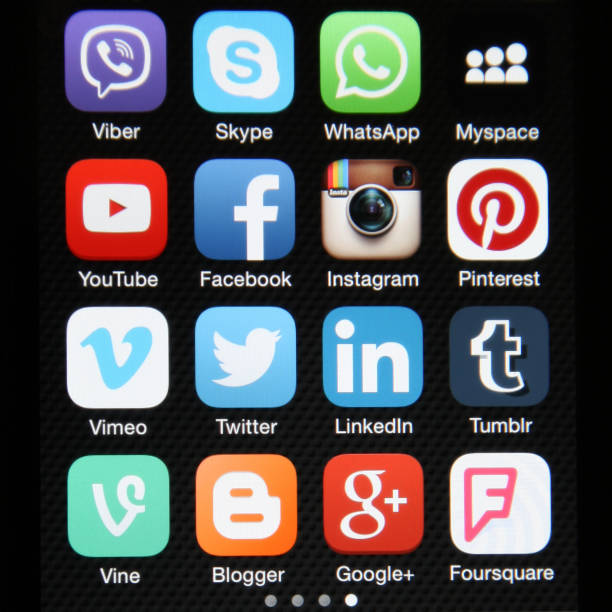 Social media icons mobile phone app applications Berlin, Germany - 07 16 2015: Apple iPhone 6 screen with social media icons internet applications Facebook,  Flickr stock pictures, royalty-free photos & images