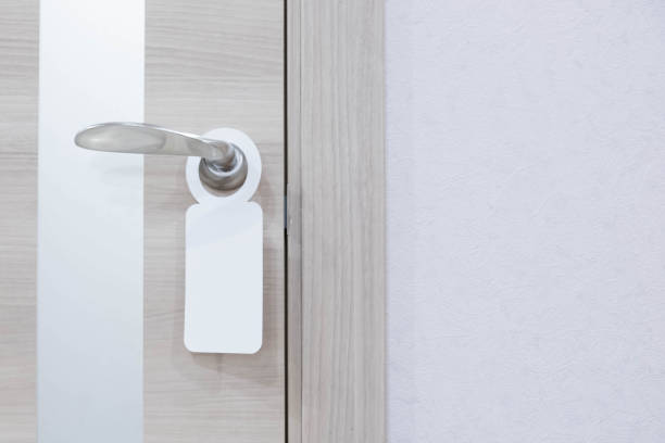 istock Empty label on a door handle for your text. door do not disturb sign 905445446
