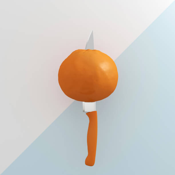 istock Creative Concept : Orange fruit impaled on stainless kitchen knives on Light blue and white background. used for graphic design and website. minimal fruit idea concept. 905448124