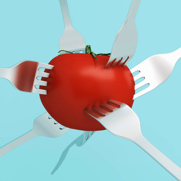 istock Creative Concept : Red tomato impaled on a stainless forks on blue pastel background. used for graphic design and website. minimal food idea concept. 905448246