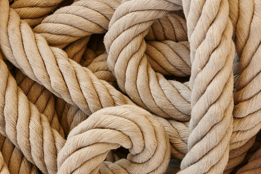 Thick rope with loops. Marine background. Horizontal