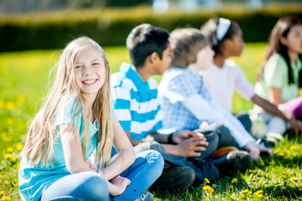 istock Sitting On The Grass In A Park 905450272