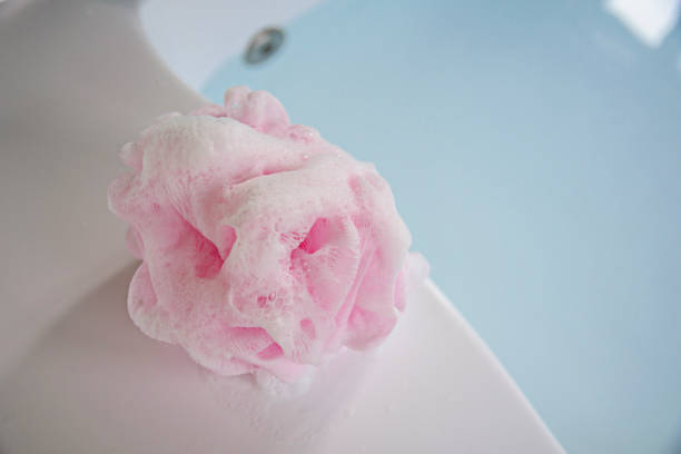 Place a foam bath foam bath sponge in the bathtub. stock photo