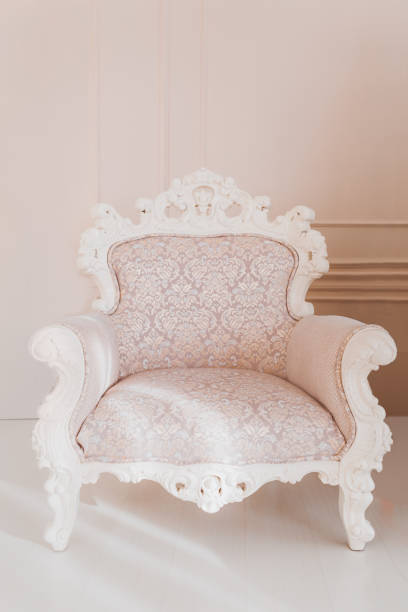istock Armchair on wall background 905450808