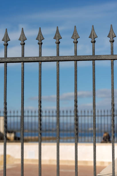 istock Forged Iron Fence with Arrows 905453512