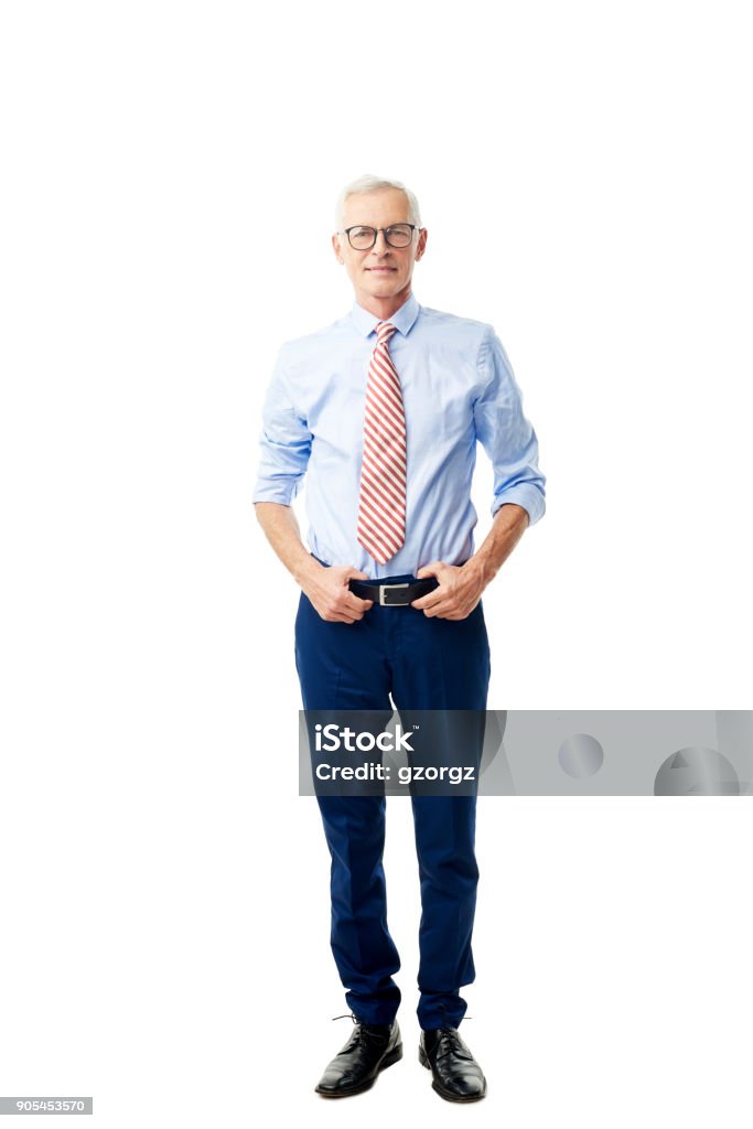 Handsome senior man portrait Full length shot of a confident senior businessman wearing shirt and tie while standing against at isolated white bakcground. White Background Stock Photo