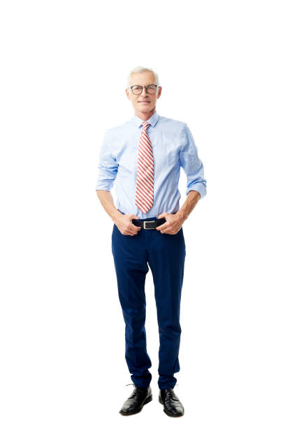 Handsome senior man portrait Full length shot of a confident senior businessman wearing shirt and tie while standing against at isolated white bakcground. rolled up sleeves stock pictures, royalty-free photos & images