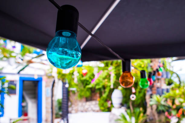 istock Multicolored lamps in a summer cafe 905453846
