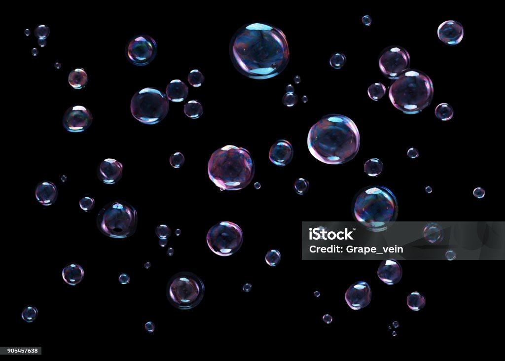 Bubbles on black background Colored soap bubbles flying on black background Bubble Stock Photo