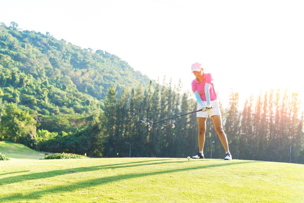 istock Motion blur golfers hit sweeping and keep golf course in the summer for relax time, sunset scenery in background 905458044