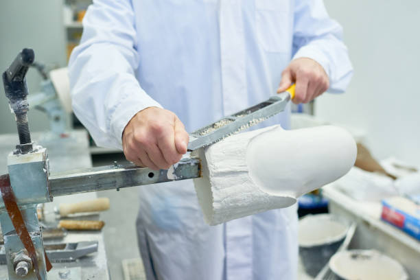 istock Prosthetist Shaping Leg Molds in Laboratory 905460538