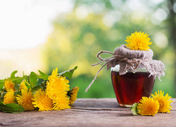 istock Jam from dandelions on a wooden table 905468164