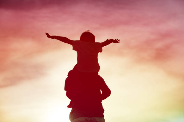 istock father and son play on sunset sky 905472754