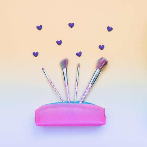 istock fashion colored makeup brushes and pink purse 905472808