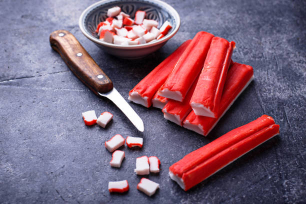 istock Crab sticks surimi and knife 905472904