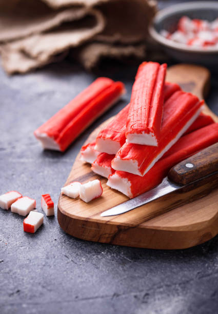 istock Crab sticks surimi and knife 905473250