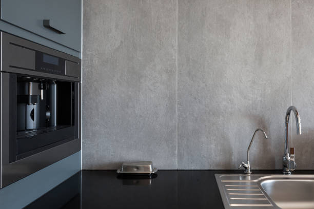 istock New modern white kitchen with built in oven and chrome water tap 905473930