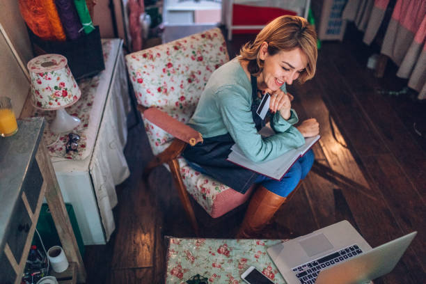 istock Young woman shopping online 905474086