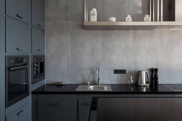 istock New modern white kitchen with built in oven and chrome water tap 905474102
