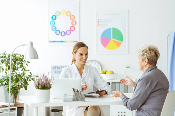 istock Smiling dietitian expert and patient 905476784