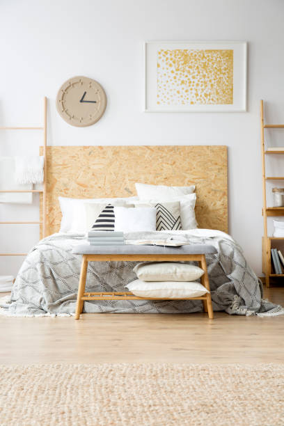 istock Gold painting in boho bedroom 905476810