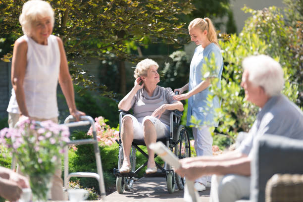 istock Disabled elderly woman in garden 905476862