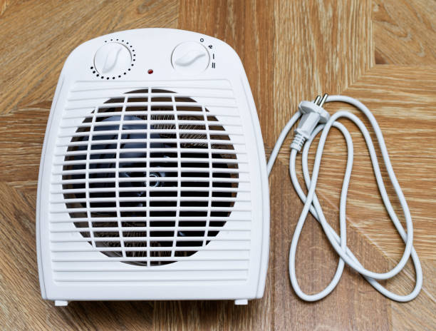 istock Modern electric fan heater at home. 905477534